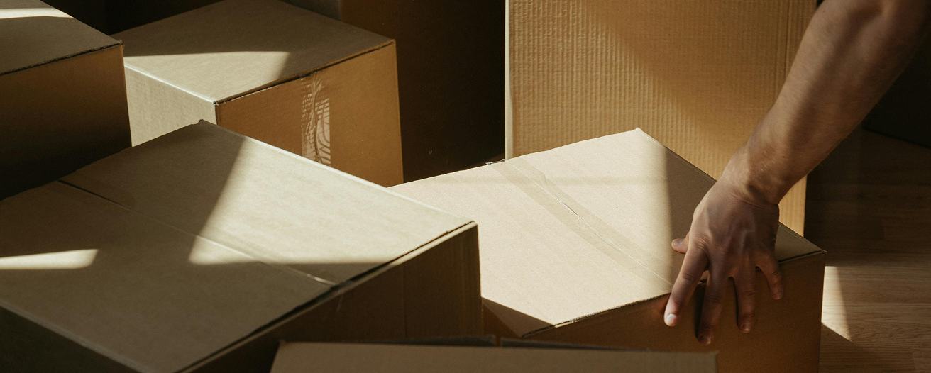 Professional mover packing boxes
